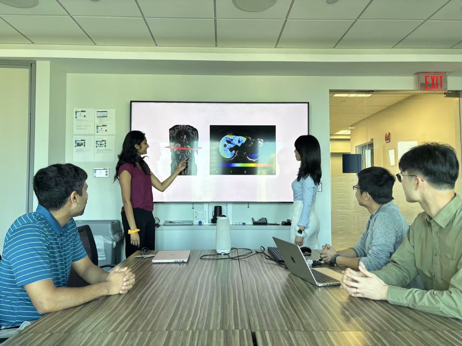 Lab members viewing media coverage of the Kamineni et al. study in 2026, second photo